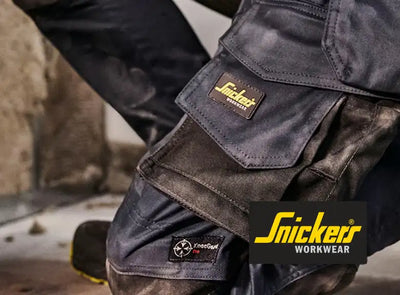 Snickers workwear black utility pants with multiple pockets and reinforced knee pads.