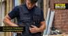 Tradesperson wearing a multi-pocket tool vest on a construction site
