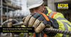 construction worker wearing protective work gloves while handling steel rebar
