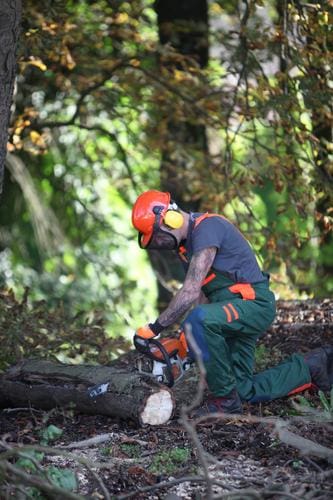 A Man Wearing Chainsaw Protective Clothes In Leeds