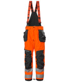 Helly Hansen Hi Viz Alna 2.0 Winter Construction salopettes/ Bib Pant Class2-71491 Hi Vis Trousers Active-Workwear The Alna 2.0 Winter Construction Pants 2.0 Class 2 has the technical solutions you need to get the work done, while keeping you warm, safe and visible. Heat transfer reflectives, innovative pocket design and a great fit ensures that you stay comfortable during the cold darks days of winter.Air permeability Class 3 Articulated knees for optimal mobility Boot gaiters with gripper