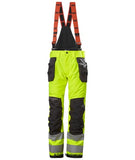 Yellow Helly Hansen Hi Viz Alna 2.0 Winter Construction salopettes/ Bib Pant Class2-71491 Hi Vis Trousers Active-Workwear The Alna 2.0 Winter Construction Pants 2.0 Class 2 has the technical solutions you need to get the work done, while keeping you warm, safe and visible. Heat transfer reflectives, innovative pocket design and a great fit ensures that you stay comfortable during the cold darks days of winter.Air permeability Class 3 Articulated knees for optimal mobility Boot gaiters with gripper