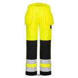 Yellow PW2 Hi Vis Holster pocket Work Trouser Non Scratch non metallic Portwest-PW242 Hi Vis Trousers PortWest Active Workwear A thoughtfully designed hi-vis trouser featuring multi-functional holster pockets, top loading kneepad pockets and a side elasticated waist. Durable Kingsmill fabric and Texpel stain resistant finish ensures that the garment stays looking new for longer. Precision engineered with anti-scratch and metal-free trims to give total peace of mind when working.