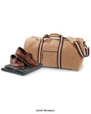 Khaki Quadra Vintage Canvas Holdall Travel Bag Kit Bag - QD613 Bags Active-Workwear Detachable adjustable shoulder strap with pad Zippered front pocket Internal valuables pocket Padded base panel 2 tone webbing detail on Sahara colourway Antique brass effect fittings Padded hand grip Dimensions 58x30