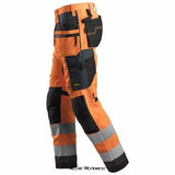 Orange Snickers All Round Work High Vis Work Trousers Holster Pockets Class 2 - 6230 Trousers Active-Workwear High vis Snickers work trousers with holster pockets suitable for everyday use. CORDURA stretch gusset ensures great fit and ease of movement. CORDURA stretch gusset, Knee Guard knee protection system, Holster pockets, Pre-bent legs, ID badge holder, Suitable for profiling