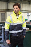 Yoko Hi Vis 2 Tone Bomber Jacket Waterproof -HVP218 Hi Vis Waterproofs Active-Workwear Conforms to EN471 Class 3 & EN343 against foul weather Waterproof Oxford PU coated polyester outer fabric The navy contrast helps to provide a corporate image whilst disguising dirt around the hem and cuff areas Qu