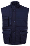 Navy Eider Bodywarmer/ Gilet Orn Workwear-4700 Workwear Jackets & Fleeces ORN Active-Workwear Perfect for manual labour roles, whether inside or outside. Multiple pockets which are large enough to carry pda's/scanners etc. Windproof Mobile pocket on chest Elasticated hip detail with extended back panel Two lower pockets with hook and loop fastening flaps hand warmers Deep elasticated armholes with weather protectors Full front zip with studded storm flap Access for decoration