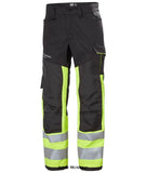 Hi Vis Yellow Helly Hansen Alna 2.0 Hi Viz Work Stretch Trousers Class 1-77420 Hi Vis Trousers Active-Workwear The Helly Alna Work Pant 2.0 Class 1 has a multi-functional thigh pocket, heat transfer reflectives and stretch fabric that provides a better fit. It is a great choice for the worker who needs to stay comfortable, safe and visible at work.  2-way stretch fabric Articulated knees for optimal mobility Broad canter back belt loop for extra stability and strength Cordura fabric