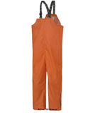 Orange Helly Hansen Mandal waterproof Bib over trousers bib and brace -70529 Waterproofs Helly Hansen Active-Workwear Keeping you dry; The Mandal Bib is great on its own or combined with our other rain wear. Features EN 343:2019 Class 4,1 Adjustable elastic suspenders Adjustable waist with snap buttons Inner chest pocket with zipper Composition