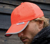 Orange Result Headwear Hi-Vis Baseball Cap-RC35 Hats Caps & Gloves Active-Workwear| Fluorescent PVC coated 4oz nylon 100% Cotton lining 6 panel Low profile Pre-curved peak with 6 stitched lines 3M™ label sewn to cap Stitched eyelets Easy tear release reflective size adjuster Unsupported front panels- suitable for embroidery & print
