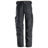 Grey Snickers Allround Work Canvas Stretch Work Trouser-6324 Trousers Snickers Active-Workwear Durable work trousers crafted for construction work with heavy-duty demands. Durable and comfortable Canvas+ fabric. Ventilation opening at back of knees. CORDURA reinforcement at knees and lower legs. KneeGuard Pro system certified according to EN 14404. Classic cargo pocket with attachment for ID badge. Tool holder, leg pocket with knife fastener, and front loops with key holder possibility.