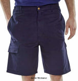 Navy Blue Workwear Budget Men's Cargo Pocket Work Shorts - Clcps Shorts & Pirate Trousers Active-Workwear 230gsm Polyester cotton industrial work shorts. Zip fly. 7 belt loop waistband with double button fastening. Sewn in crease. 2 Swing hip pockets. 2 Cargo pockets. 2 Rear pockets with stud flap. 